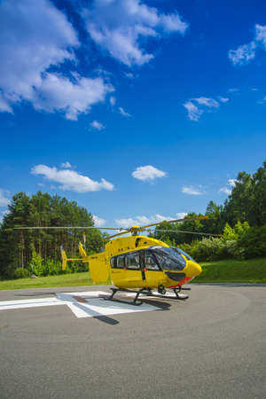 Paramedics helicopter prepared to uploading patient with dors open