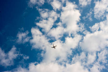 View of a photography drone on a blue skyの写真素材