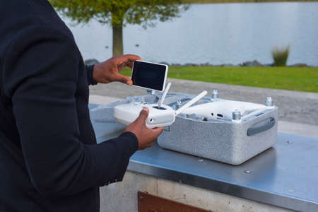Drone equipment near a lake and the drone box delivered package