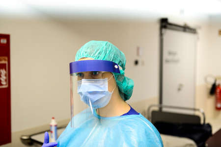 Doctor wearing disposable coverall with mask and safety google  in hospital. Pandemic 2019 Coronavirus 2019-nCoV.の写真素材