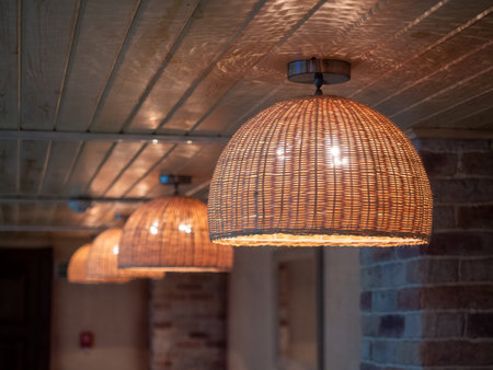 Ceiling lamp on a wooden ceiling in a cafe or restaurantの写真素材