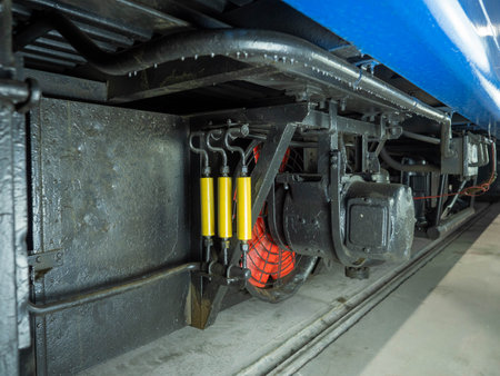 The image of a locomotive close-up. Industrial background.