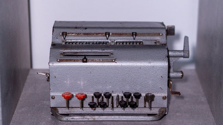 Old vintage calculating machine in a museum, close-up, selective focusの写真素材