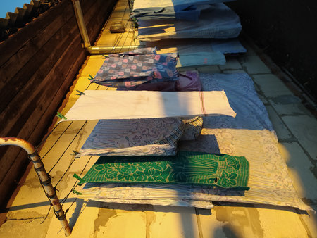 Washed clothes dry on clotheslines outside in the village in the sun