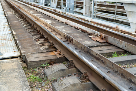 Railway tracks with rails and sleepers in the countrysideの写真素材