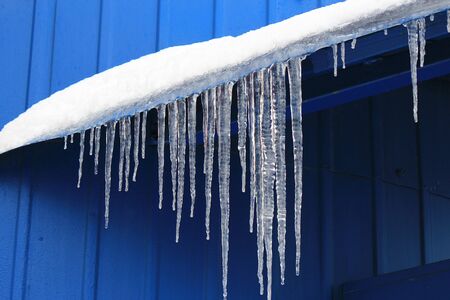 ice icicles on the roofの写真素材