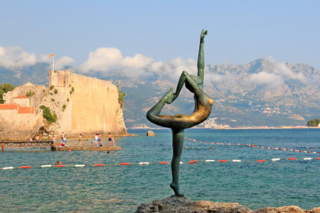 View of the Adriatic Sea with an unusual statue of  lady stretching her body like a ballet dancerのeditorial素材