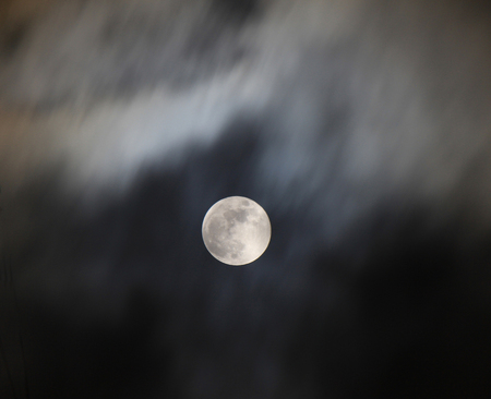 A huge bright moon in the night sky