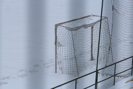 football goal on the winter football fieldの写真素材