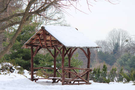 gazebo made of crooked logs in the botanical gardenの写真素材