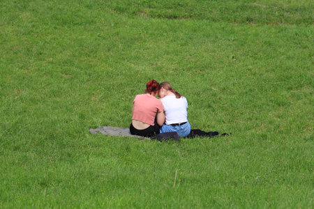 girlfriends view interesting photos on a smartphoneの写真素材