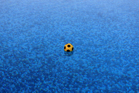 water polo ball on the surface of the poolの写真素材
