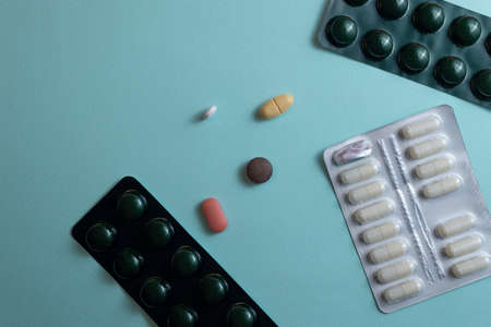 Multicolored pills and blister packsの写真素材