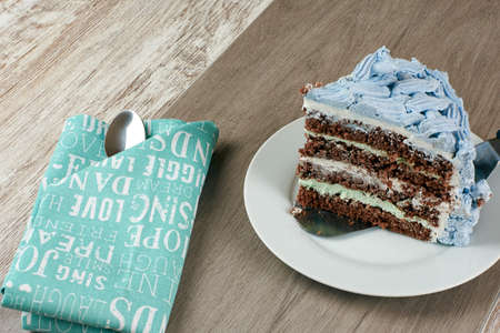 homemade heart shaped like a box blue-violet cake with chocolate pralines and coconut, decorated...