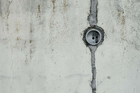wall with a circle in the part superior, broken wall of white color with a broken vertical line.の写真素材