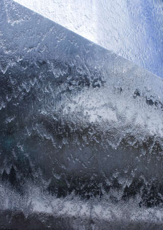 Cold background with flowing water vertically, liquid textureの写真素材