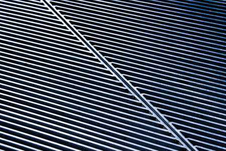 Metal texture with narrow holes, iron background