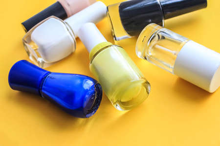 Manicure set beauty hands. Yellow backgroundの写真素材