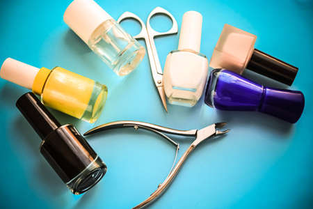 Set for nail care, manicure tools scissors on a blue backgroundの写真素材