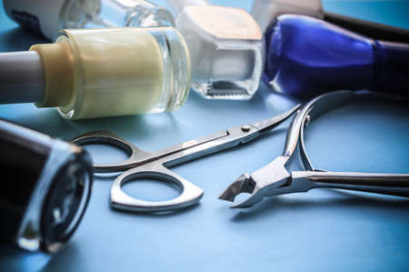 Set for nail care, manicure tools scissors on a blue backgroundの写真素材