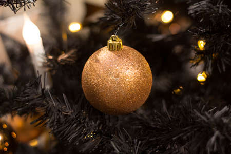 golden christmas ball on a tree, beautiful decoration for the new year