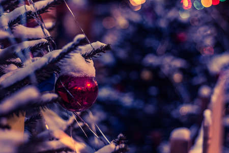 New Year's toys hang on the Christmas tree, festive decoration on the tree, Christmas