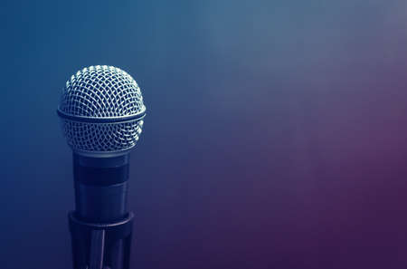 Microphone in studio on a violet background, a tool for the singerの写真素材