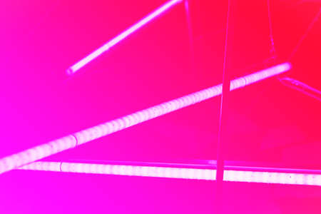 Halogen or led light lamps Neon light tubes. Gradient pink backgroundの写真素材