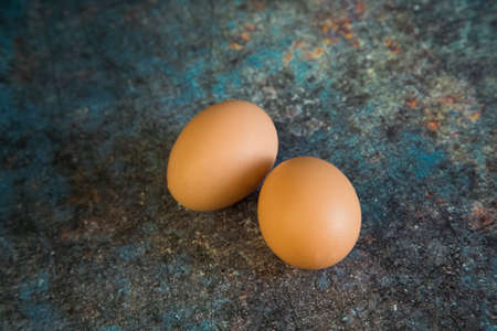 Two eggs on a rustic background. Selective focus. Food.の写真素材