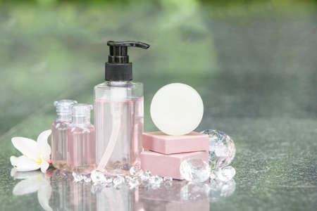 Shampoo and soap bars on light background. Personal care product spa concept
