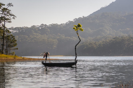 Fisherman with a boat on the lake in the morning.の写真素材