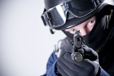 Large portrait of the soldier aiming a pistolの写真素材