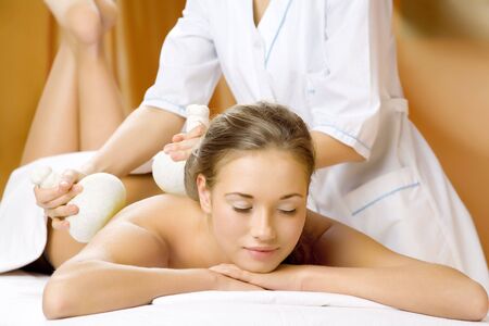 The young beautiful girl has a massage sessionの写真素材