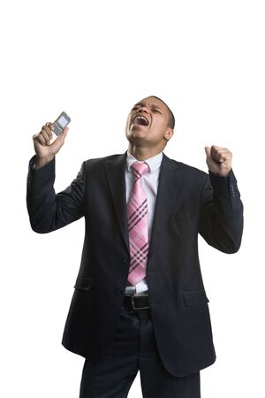 The businessman with a mobile phone on a white backgroundの写真素材