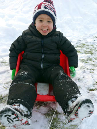 Boy enjoy playing in the snow