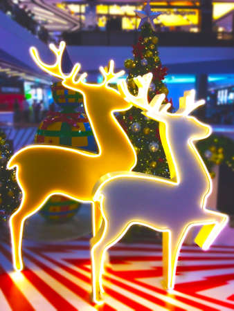 White and yellow light reindeers, The department store decorated for Christmas time.の写真素材