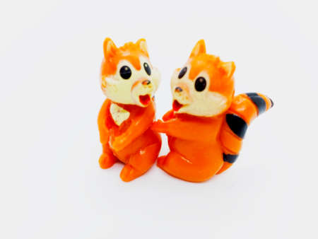 Two orange squirrels doll isolated on white background with clipping path.の写真素材