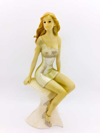 Super model resin doll with golden short dresses for decoration. Isolated on white background with clipping path.の写真素材