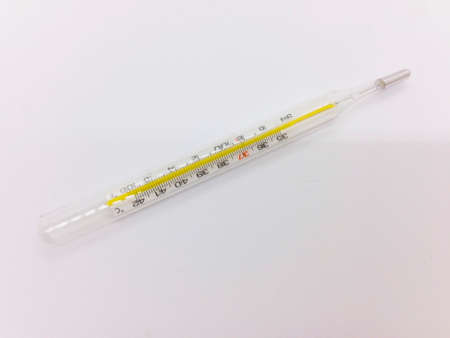 Medication concept, glass thermometer is isolated on white background with clipping path.