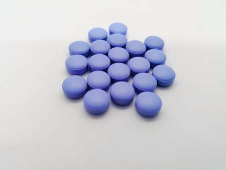 Medication concept. Diclofenac use for relief pain and reduce muscle inflammation. Many violet pills...
