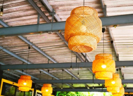 The concept of life may sometimes be dark. Handmade bamboo lantern, decorated for light on the ceiling. Selective focus and copy space.の写真素材