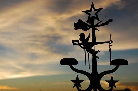 Angel and star flying in the skyの写真素材