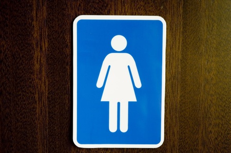 Signage of lady room on Oak wood background.の写真素材