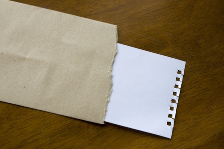 White blank note in a brown envelope