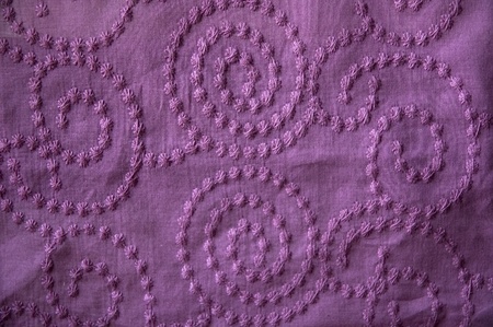 floral texture on violet fabric. 
