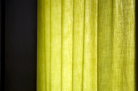 green curtain with natural window light background imageの写真素材