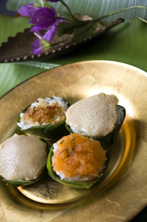 Thai native dessert on golden plate in old styleの写真素材