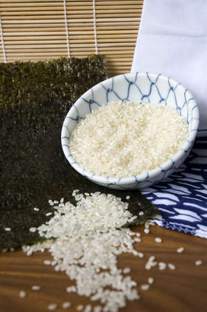 uncooked Japanese white rice in bowlの写真素材