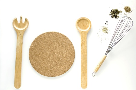 wooden kitchenware and wire whisk on white backgroundの写真素材