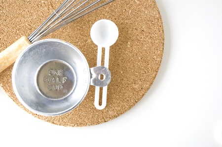 measuring one half cup with spoon on board